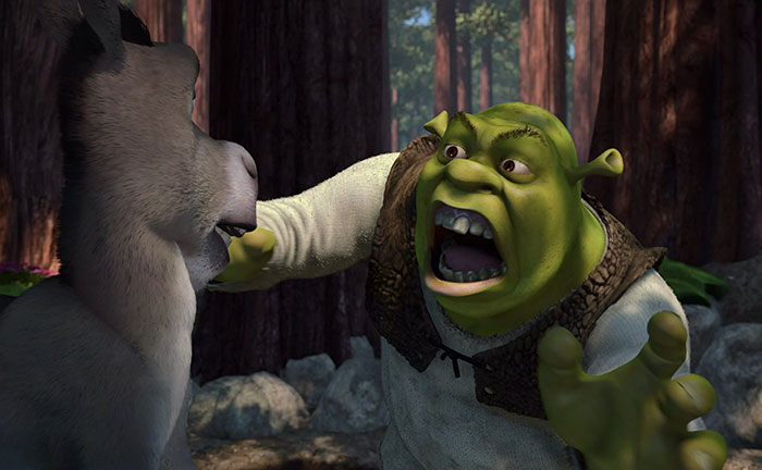 Shrek roaring loudly at Donkey in the deep swamp, showing an intense moment from the iconic Shrek quotes.