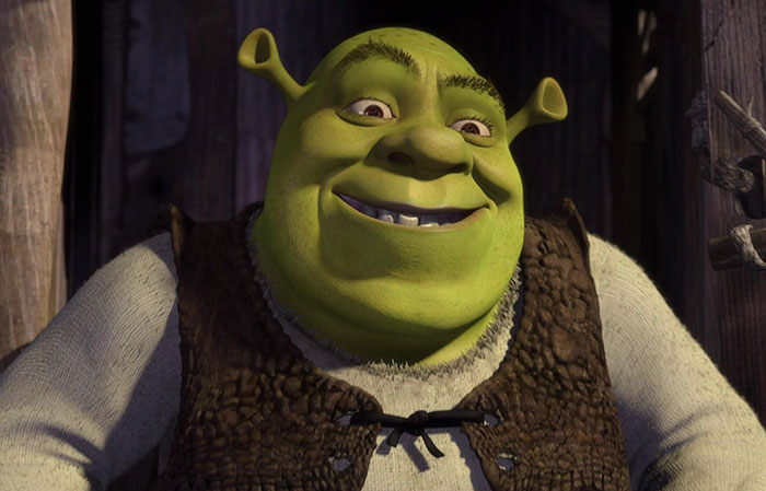 Shrek smiling inside his swamp home, featuring iconic character from popular Shrek quotes and deep swamp scenes.