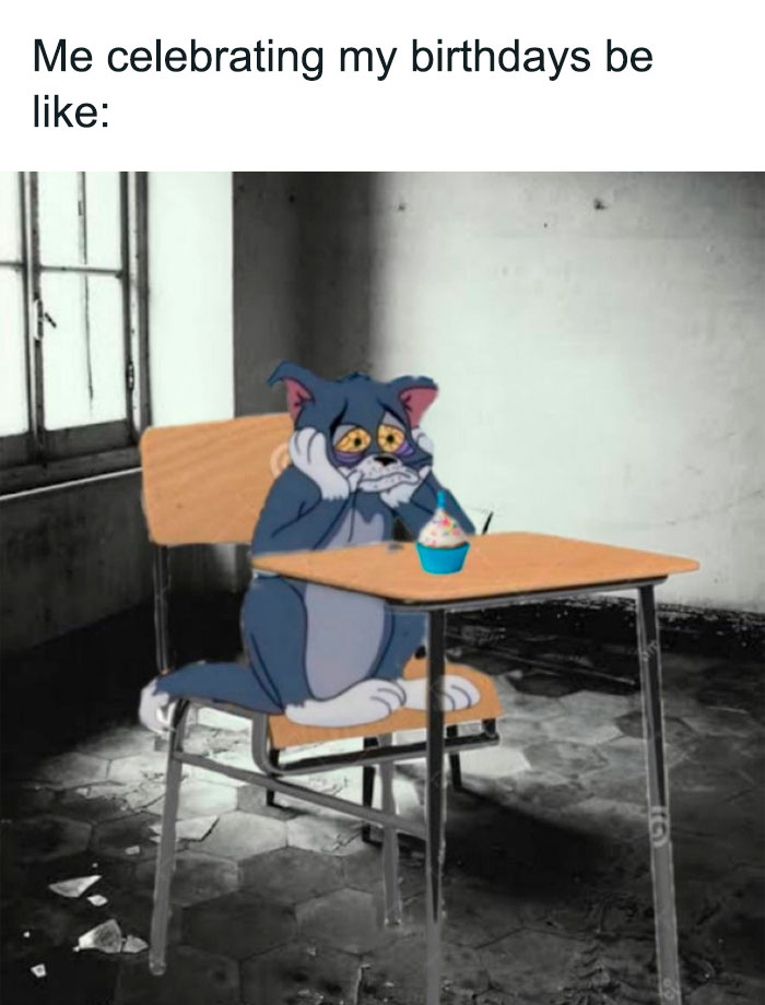 Tom from Tom & Jerry looking sad at a desk with a cupcake, relatable meme about birthdays.
