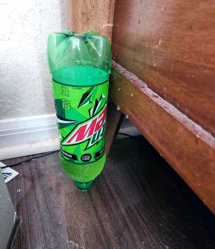 Knocked A Bottle Over And It Landed Perfectly Upside Down Without The Cap. How Do I Pick It Up Now Without Spilling Everything?