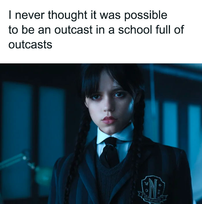 Wednesday Addams in school uniform with a caption about feeling like an outcast.