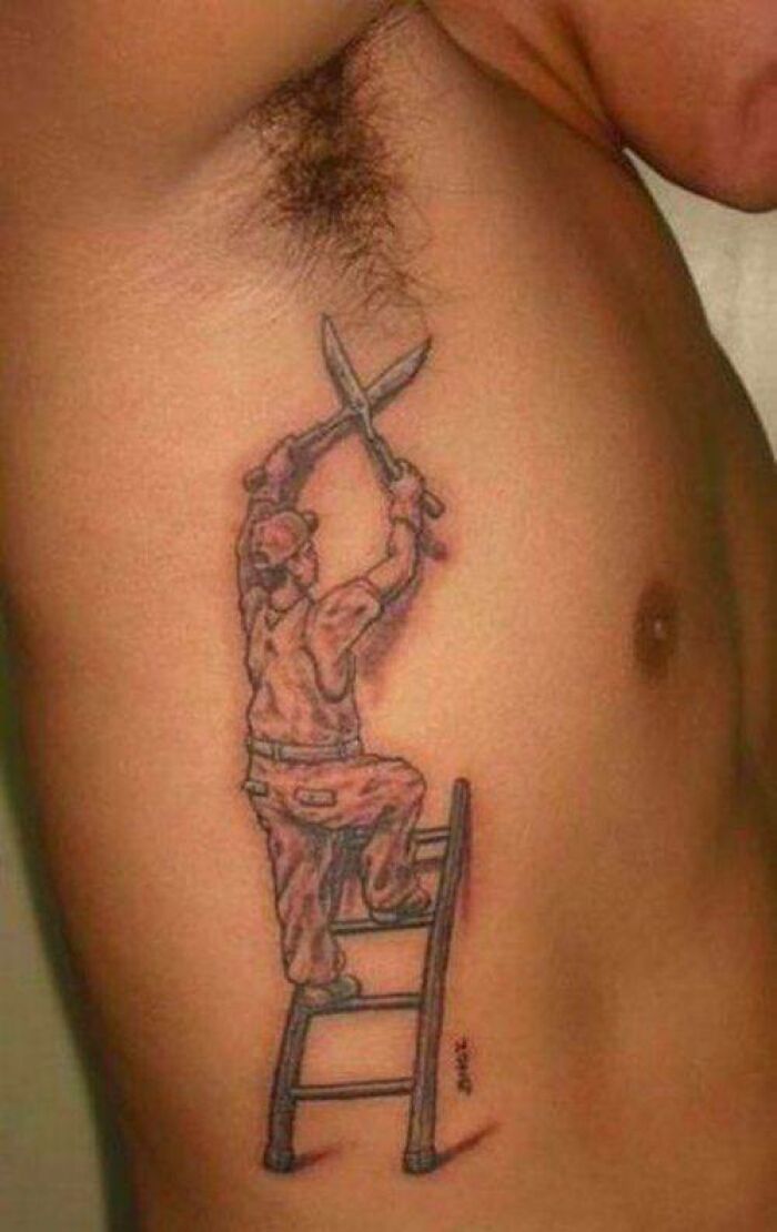 Tattoo fail of a man trimming armpit hair with shears on a ladder.