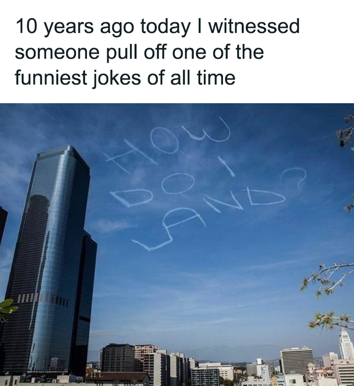 Skywriting over city buildings spelling out a funny relatable meme question, illustrating hilariously relatable memes.