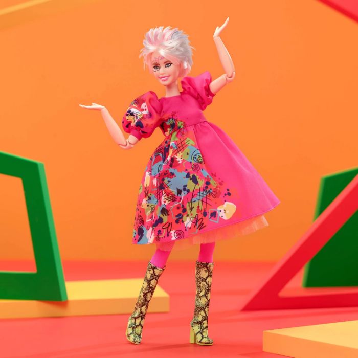 Weird Barbie in a vibrant pink dress and patterned boots, set against an abstract colorful background. Weird Barbie in a vibrant pink dress and patterned boots, set against an abstract colorful background.