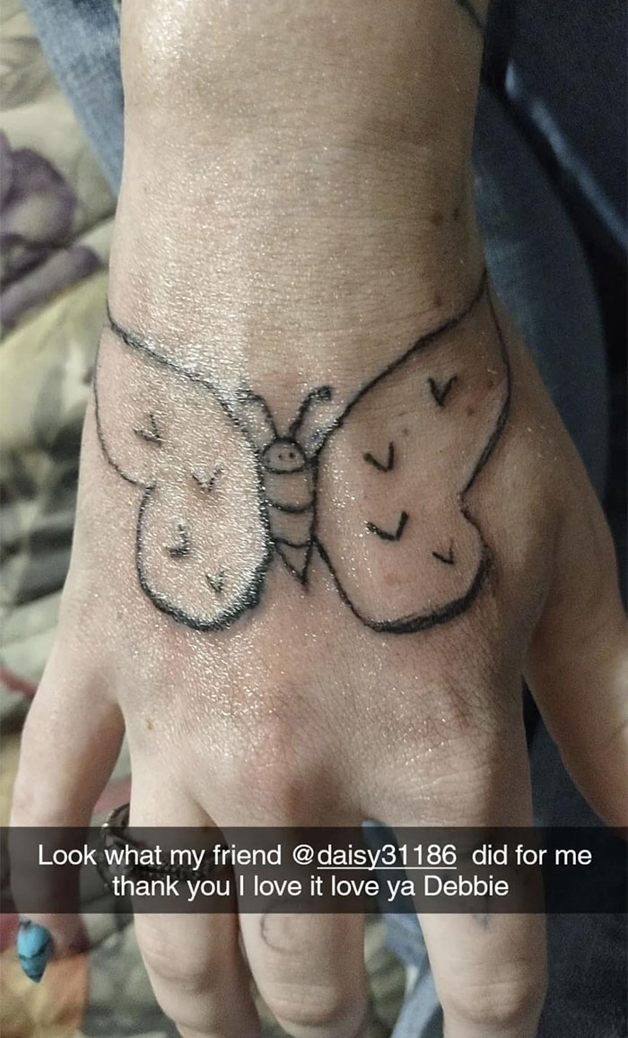 Butterfly tattoo on hand, featuring uneven wings, symbolizing permanent mistake in design.