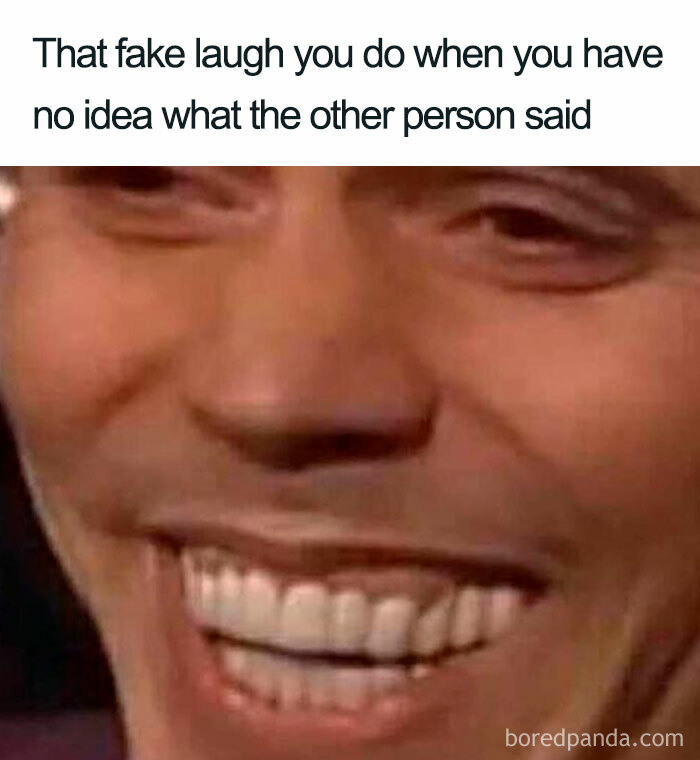 Close-up of a person's exaggerated smile, illustrating a funny life meme.