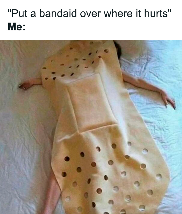 Person lying on bed covered completely with an oversized bandage costume in a relatable meme format.