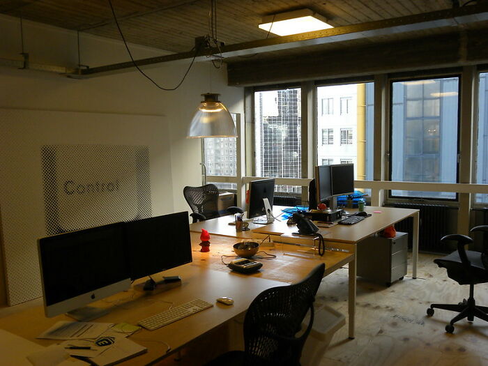 Modern office workspace with computers and chairs, illustrating the concept of things that eventually disappeared unnoticed.