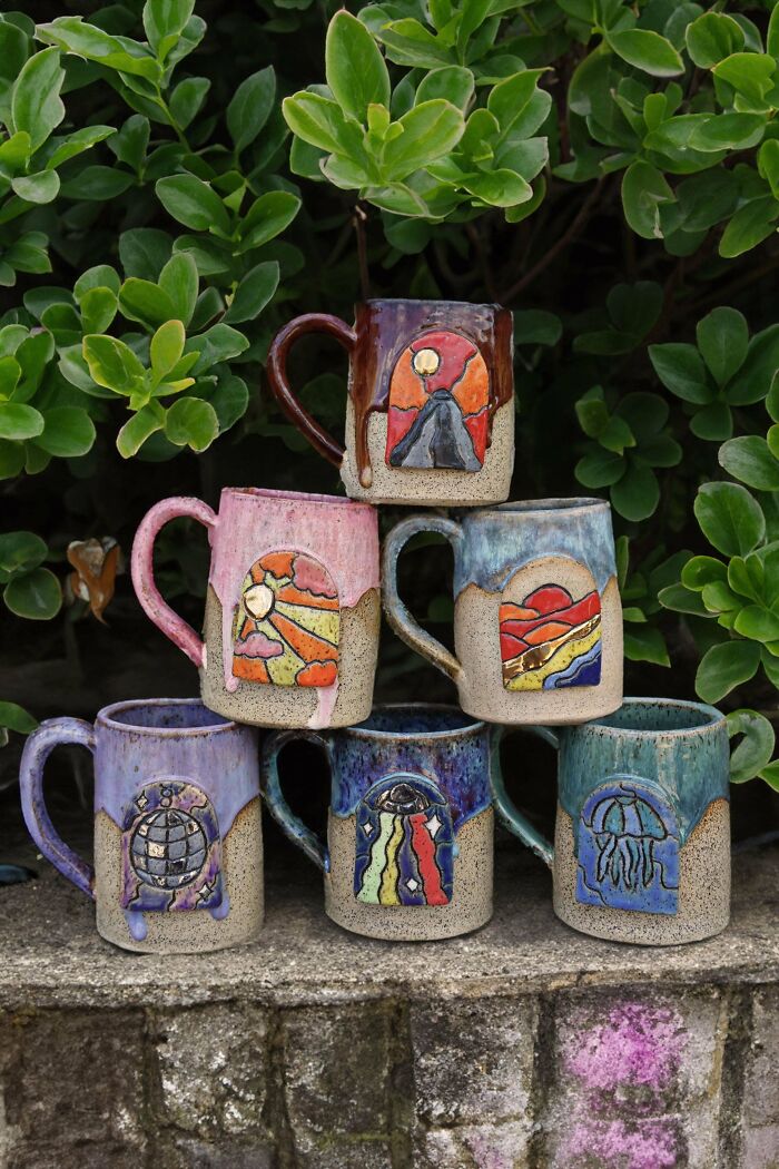 Handcrafted ceramic mugs with colorful artistic designs, showcasing creative mug life beyond traditional usage.