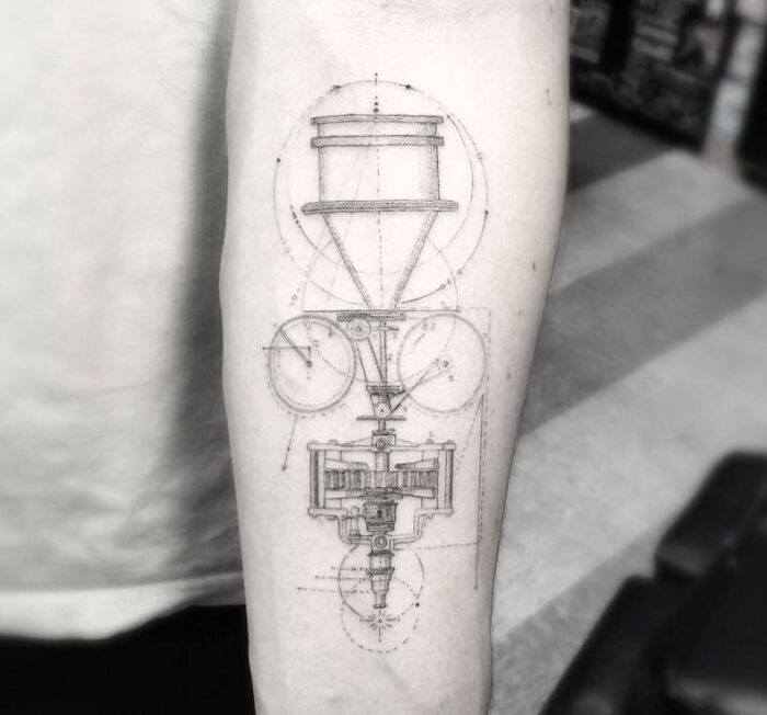 Science tattoo featuring intricate geometric design on an arm.