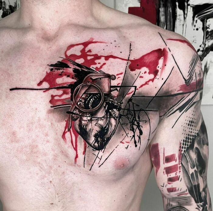 Trash Polka tattoo design featuring abstract red and black elements on a person's chest.
