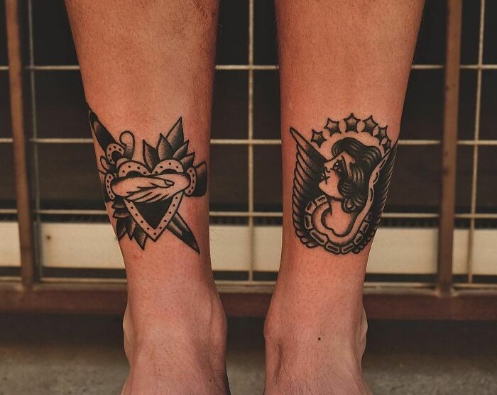 American traditional tattoos featuring a heart with a dagger and a winged angel design on legs.