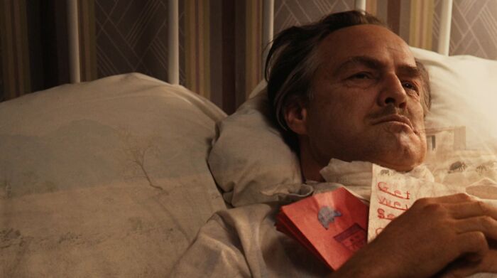 Don Vito Corleone ill laying in the bed 