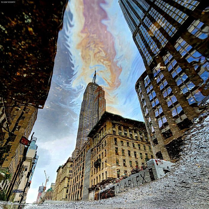 ITAP Of The Empire State Building Reflected In An Oily Puddle