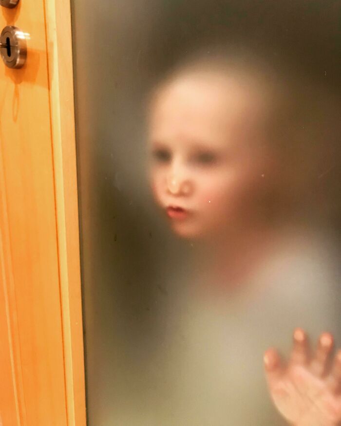 Our Airbnb Had A Translucent Bathroom Door. I’m Used To My Impatient Toddler Stalking Me Through The Door, But This Took It To A Much Creepier Level