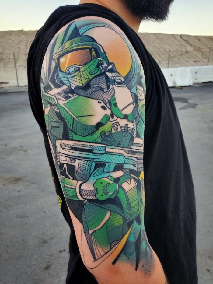 Tattoo of a Doom video game character with green armor on a person’s arm, perfectly designed for hardcore gamers.