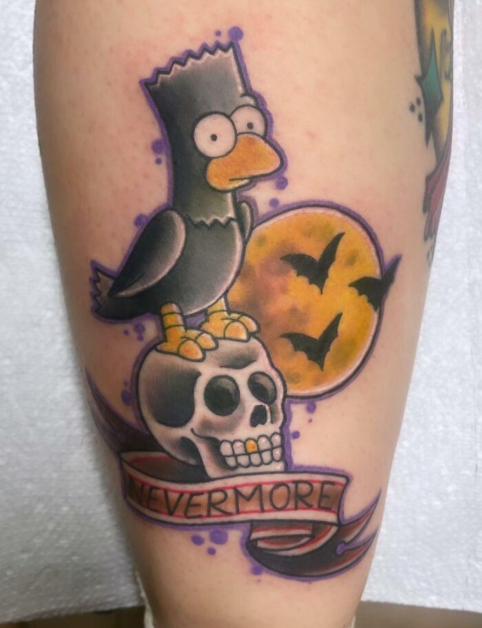 Cartoon tattoo of a raven on a skull with "Nevermore" banner, moon and bats in the background.