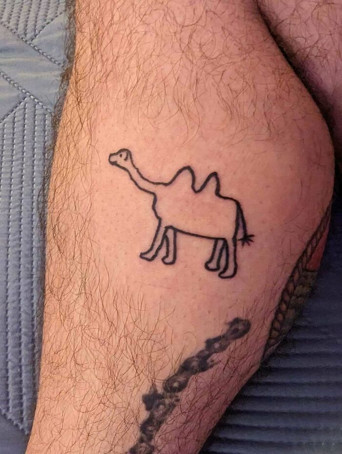 Poorly drawn camel tattoo on a person's leg, highlighting the importance of researching tattoo artists better.