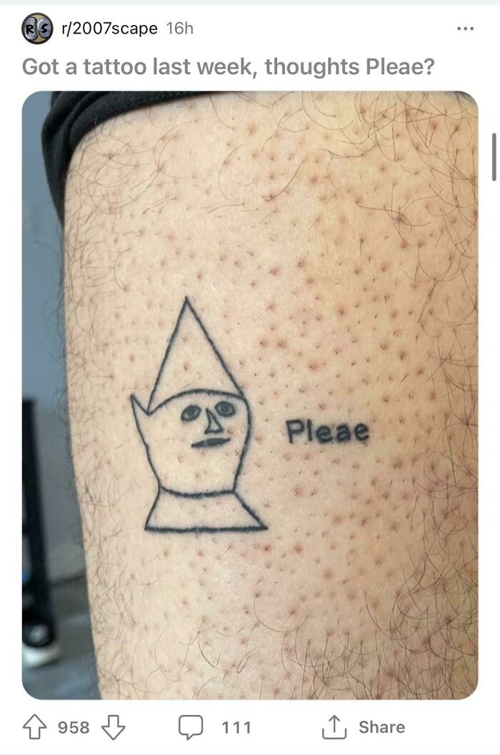 Tattoo with a misspelled word and abstract face on skin; highlights researching tattoo artists before getting inked.