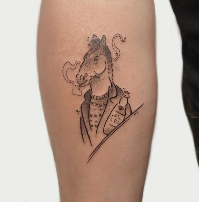 Cartoon tattoo of an anthropomorphic Bojack Horseman horse smoking, in a suit jacket holding a bottle.