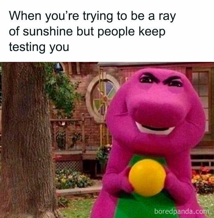 Purple dinosaur holding a yellow ball, captioned with a humorous take on life's challenges.