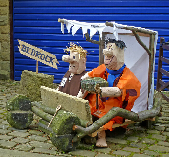 Wooden characters in a Bedrock-themed car, illustrating what eventually disappeared without anyone noticing concept.