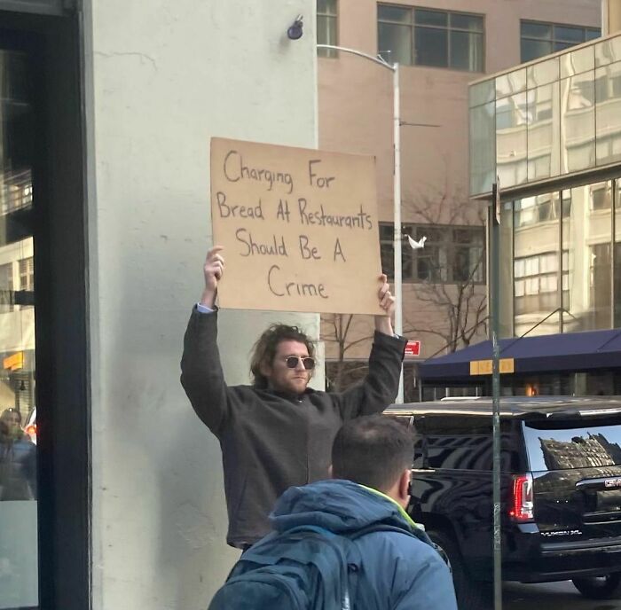 Clever-Dude-With-Sign-Protesting-Annoying-Things