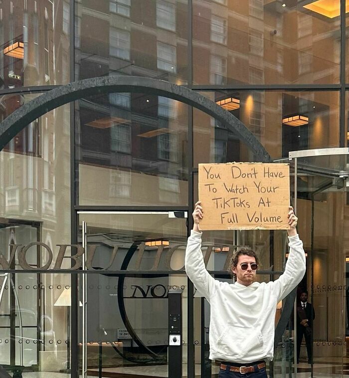 Clever-Dude-With-Sign-Protesting-Annoying-Things