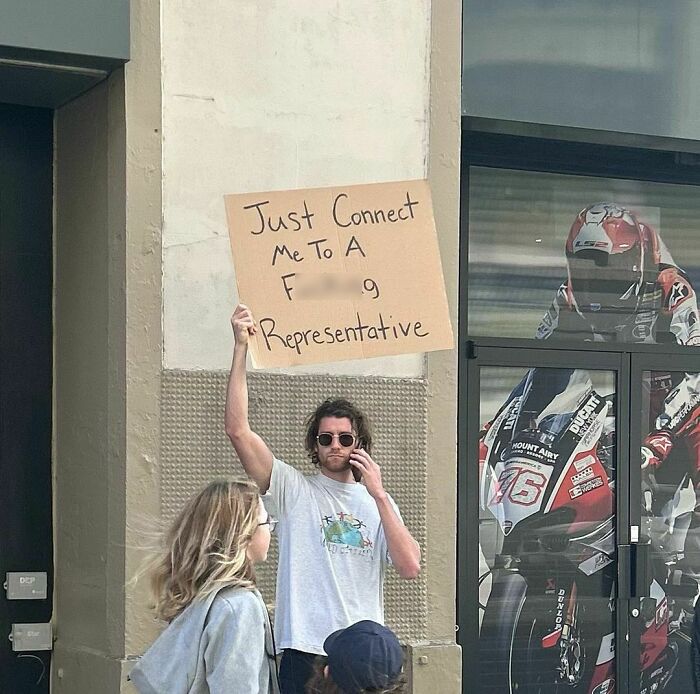 Clever-Dude-With-Sign-Protesting-Annoying-Things