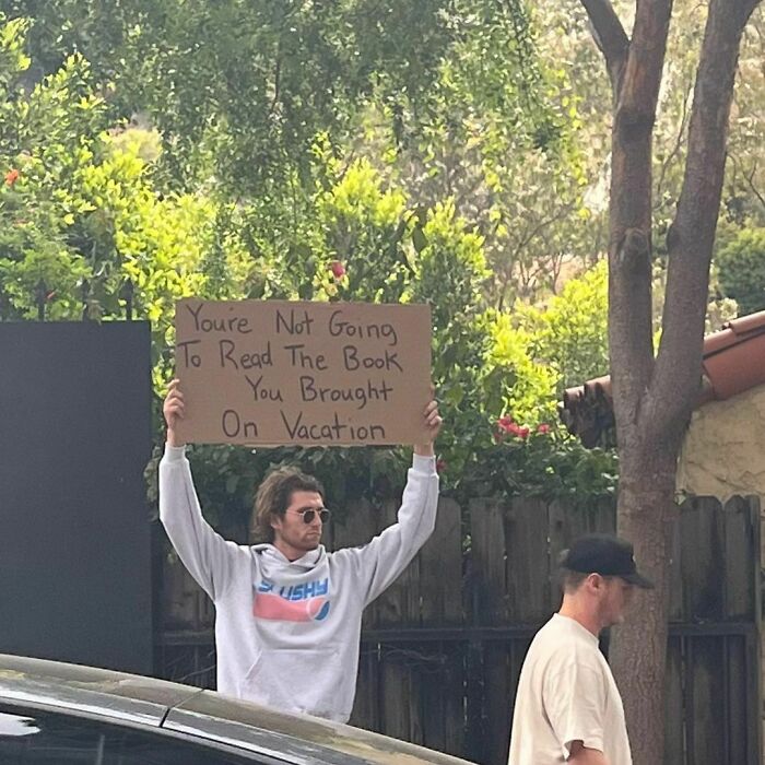 Clever-Dude-With-Sign-Protesting-Annoying-Things