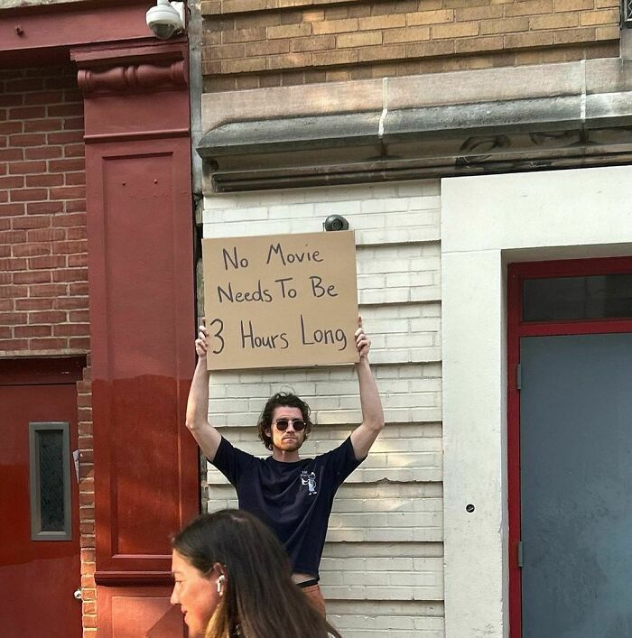 Clever-Dude-With-Sign-Protesting-Annoying-Things