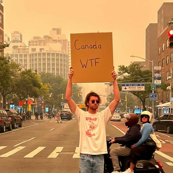 Clever-Dude-With-Sign-Protesting-Annoying-Things