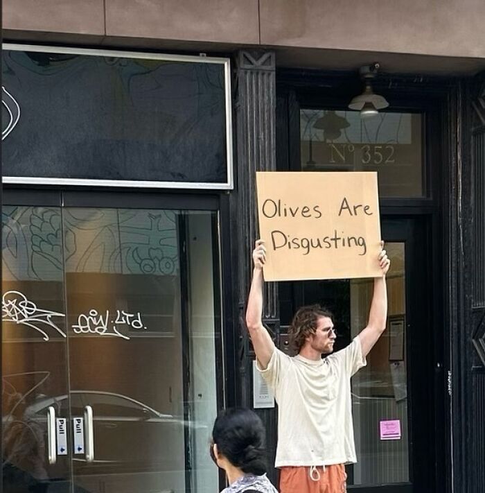 Clever-Dude-With-Sign-Protesting-Annoying-Things