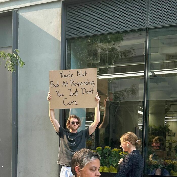 Clever-Dude-With-Sign-Protesting-Annoying-Things