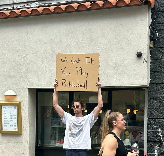 Clever-Dude-With-Sign-Protesting-Annoying-Things
