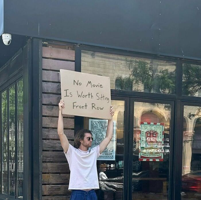 Clever-Dude-With-Sign-Protesting-Annoying-Things