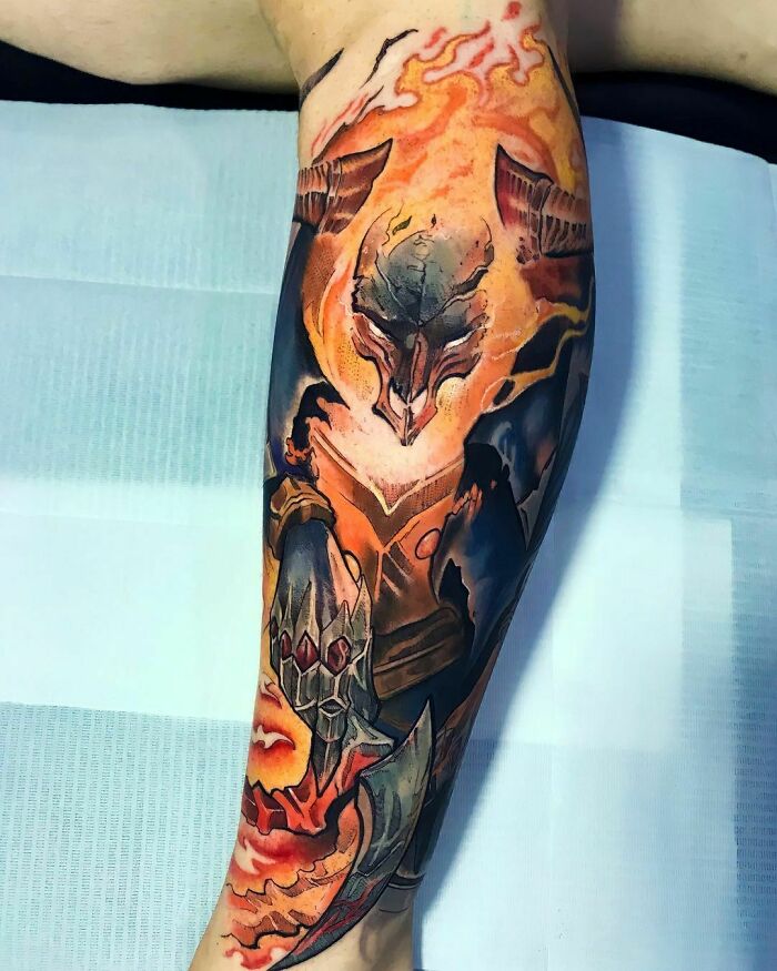Tattoo of a fiery armored Thresh character from League Of Legends video game on a forearm, showcasing vibrant colors and intricate design.