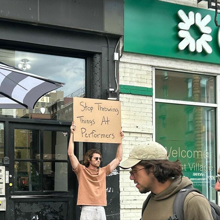 Clever-Dude-With-Sign-Protesting-Annoying-Things