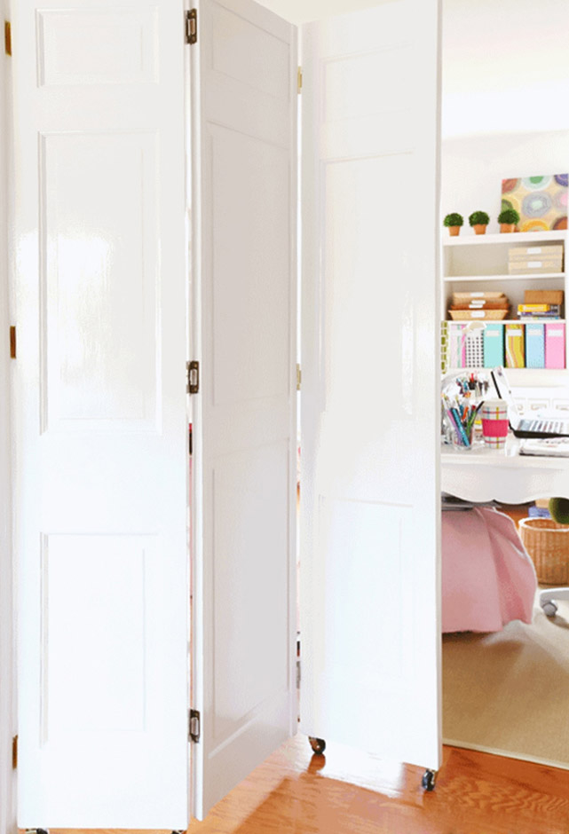 White, wooden three parts rolling doors room divider White, wooden three parts rolling doors room divider