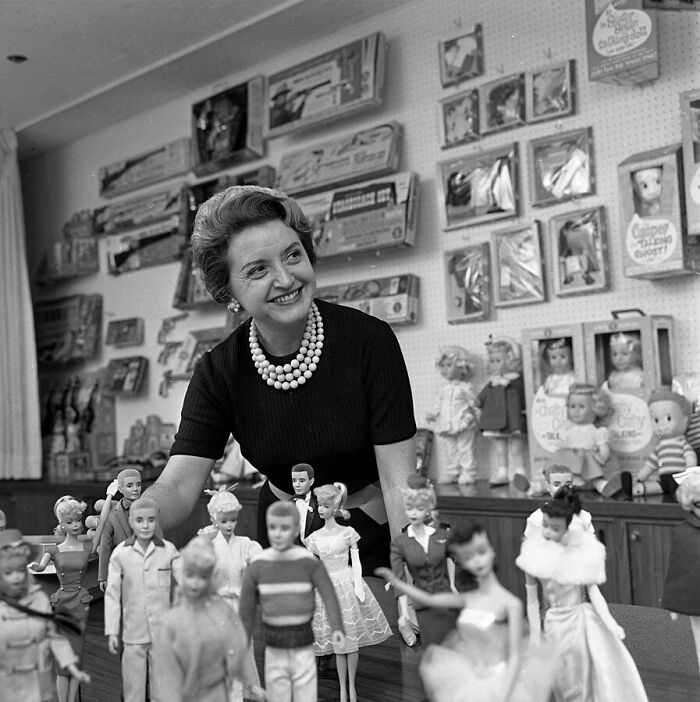 Ruth Handler, Mattel executive, with a collection of Barbie dolls in 1961, illustrating useless facts to impress friends.