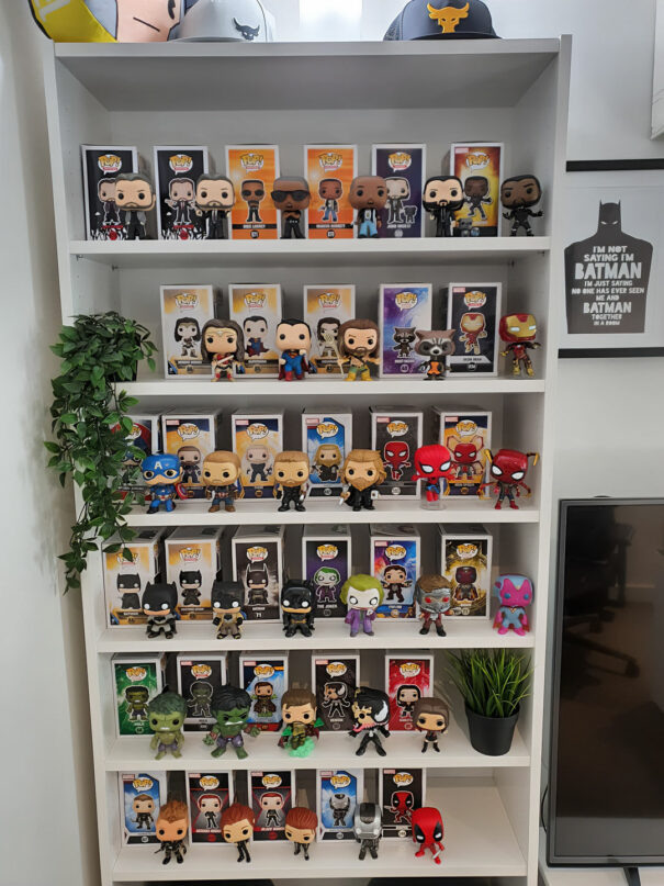 Funko Pop collection displayed on bookshelf