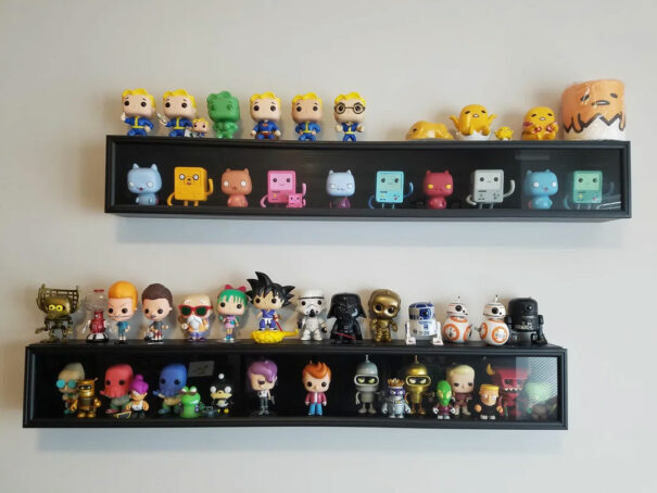 Funko pop collection displayed on Baseball bat shelf