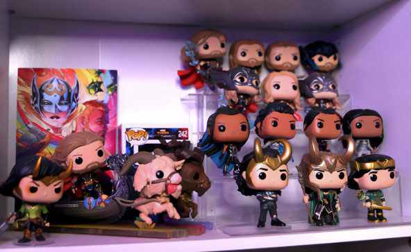 Thor and Moon Knight Funko Pop collection displayed on pastry cabinet