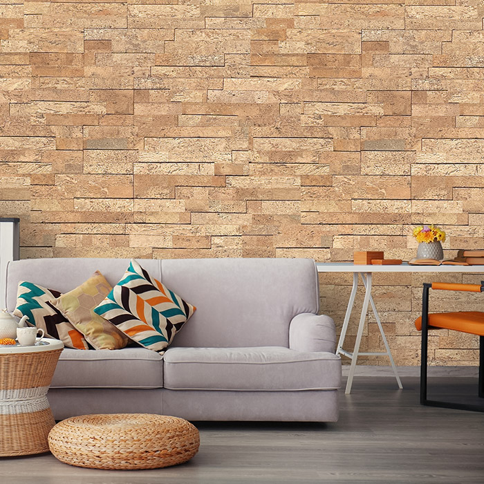 Wood brick wall in workroom with gray sofa and desk