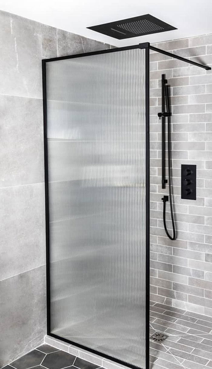 Black Shower Head In A Grey Bathroom Black Shower Head In A Grey Bathroom