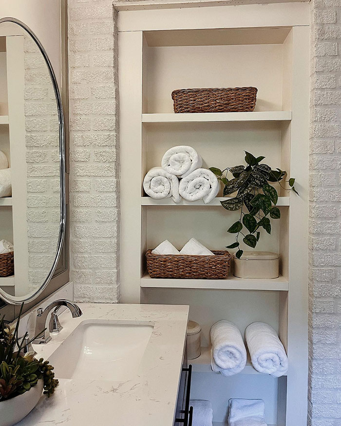 Minimalist Design Open Shelving Storage Near A Bathroom Sink Minimalist Design Open Shelving Storage Near A Bathroom Sink