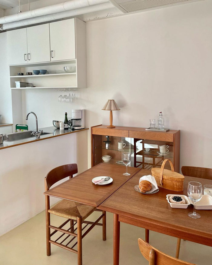 Breakfast nook with convertible brown wooden table Breakfast nook with convertible brown wooden table