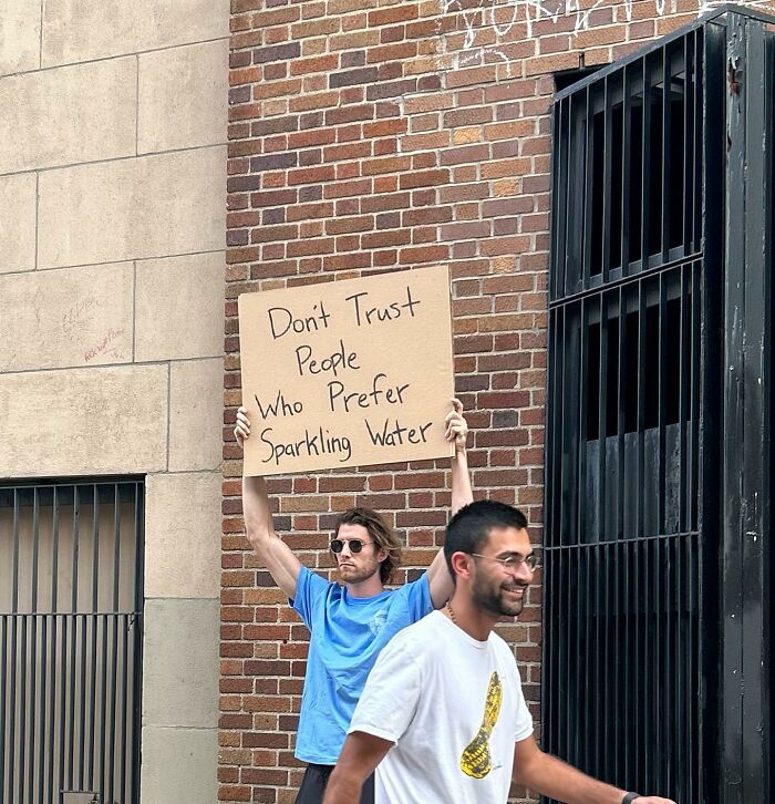 Clever-Dude-With-Sign-Protesting-Annoying-Things