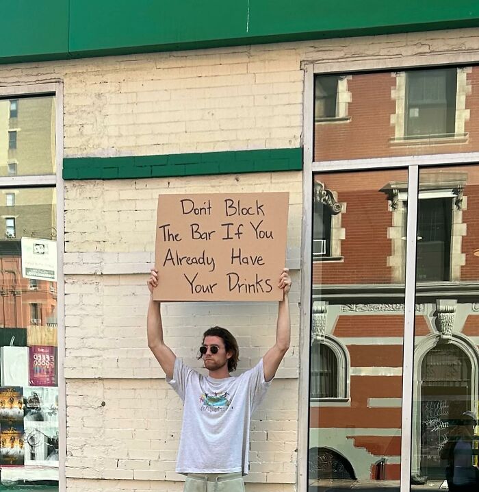 Clever-Dude-With-Sign-Protesting-Annoying-Things