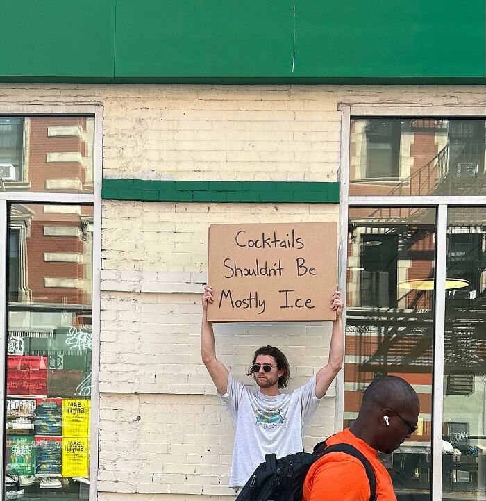 Clever-Dude-With-Sign-Protesting-Annoying-Things